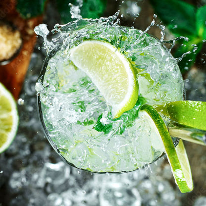 Refreshing lime and mint cocktail with ice, evoking crisp citrus room spray scents