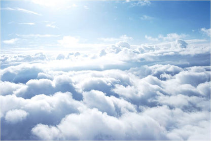 Aerial view of bright blue sky and white clouds, representing fresh clean air