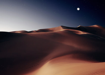 Moonlit desert sand dunes under a starry night sky